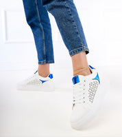 Person wearing Alnora Urban Platform Sneakers with blue accents and jeans, demonstrating modern urban footwear style.
