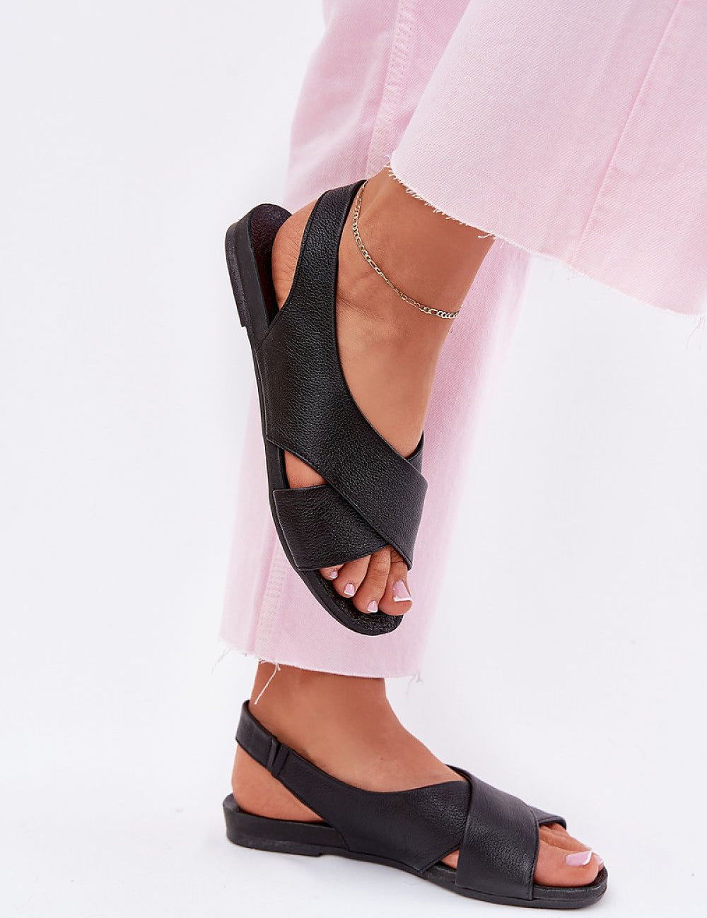 Talmea Soft-Strap Leather Sandals with pink pants, open heel and toe, showcasing style and comfort for warm-weather wear.