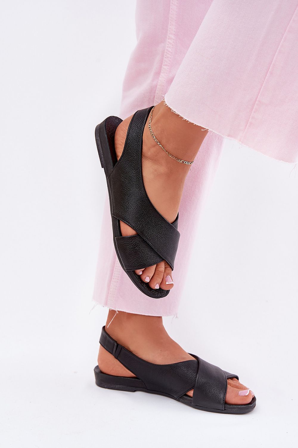 Talmea Soft-Strap Leather Sandals with pink pants, open heel and toe, showcasing style and comfort for warm-weather wear.