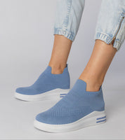 Light blue Shadowknit slip-on sock sneakers with a white platform sole, showcasing a flexible, stylish, and comfortable urban design.