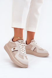 Caravelle mixed-leather platform sneakers with suede accents and elevated sole, worn with white pants for a chic look.