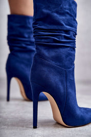 Celvarine Silkwrinkle Tall Poise high-ankle blue eco suede boots with stiletto heel and pointed toe, showcasing graceful creasing.