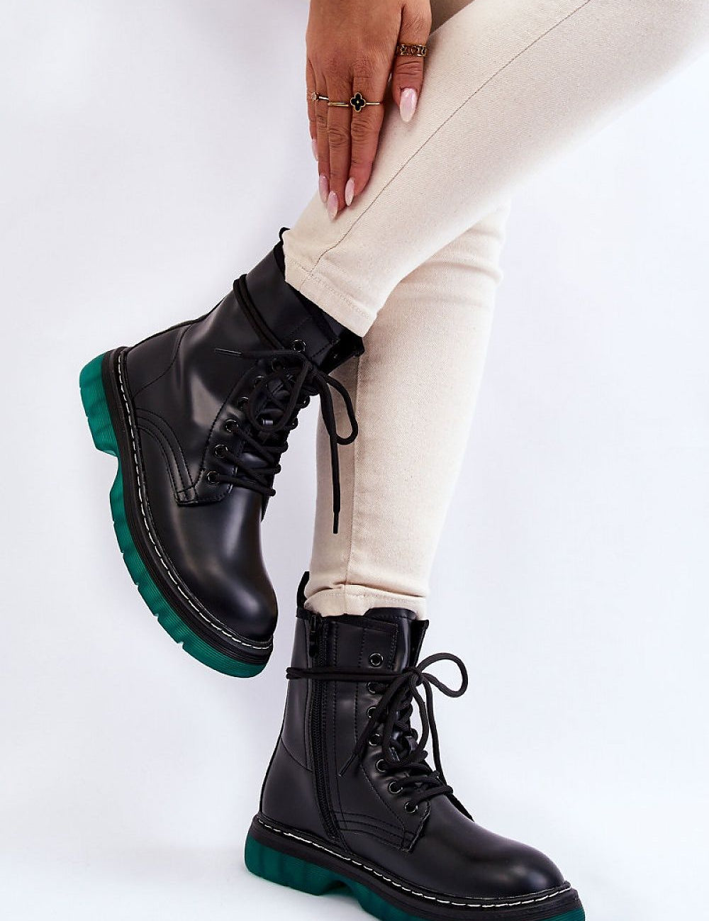 Varnisse Hollowtread platform boots with lace-up design and green treaded sole, showcasing style and functionality.