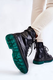 Varnisse Hollowtread Warm Structure boots with green treaded sole and black eco leather, showing side view and lace-up design.