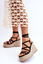 Woman wearing Ardavia Jute Platform Sandals with faux suede straps and jute base, styled with a crochet skirt.