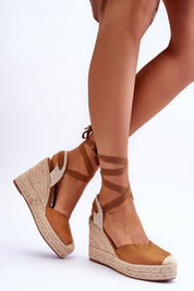 Liorenna lace-up platform sandals in brown eco-suede with jute-wrapped sole, showcasing boho style and height.