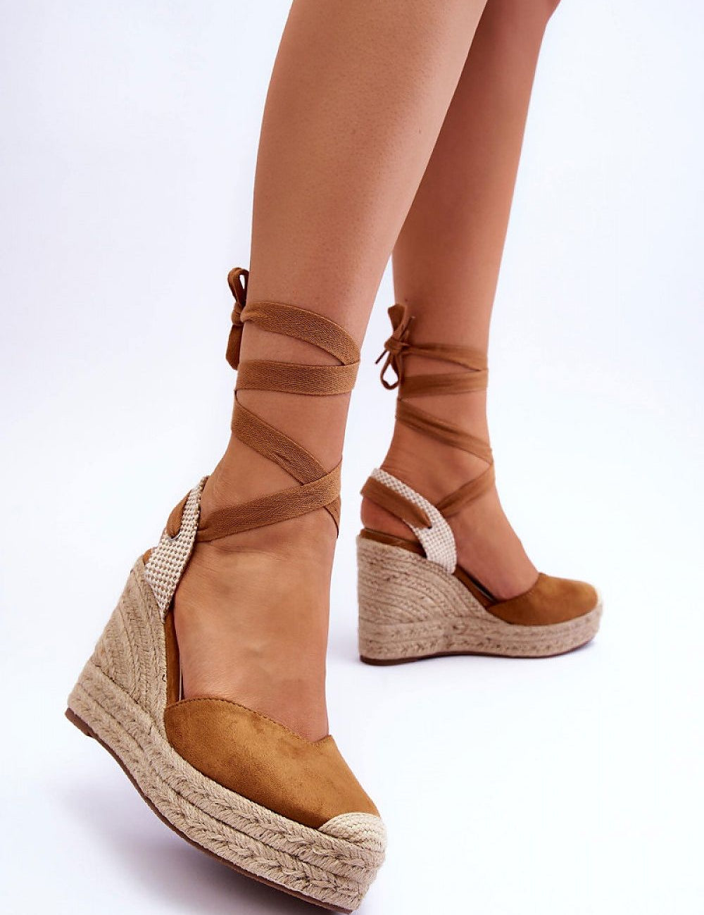 Liorenna lace-up platform sandals in eco-suede with jute-wrapped sole and calf lacing, offering boho style and comfort.