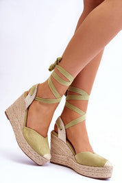 Liorenna Lace-Up Platform Sandals in green eco-suede, featuring jute-wrapped soles and calf lacing for a boho-chic look and comfort.