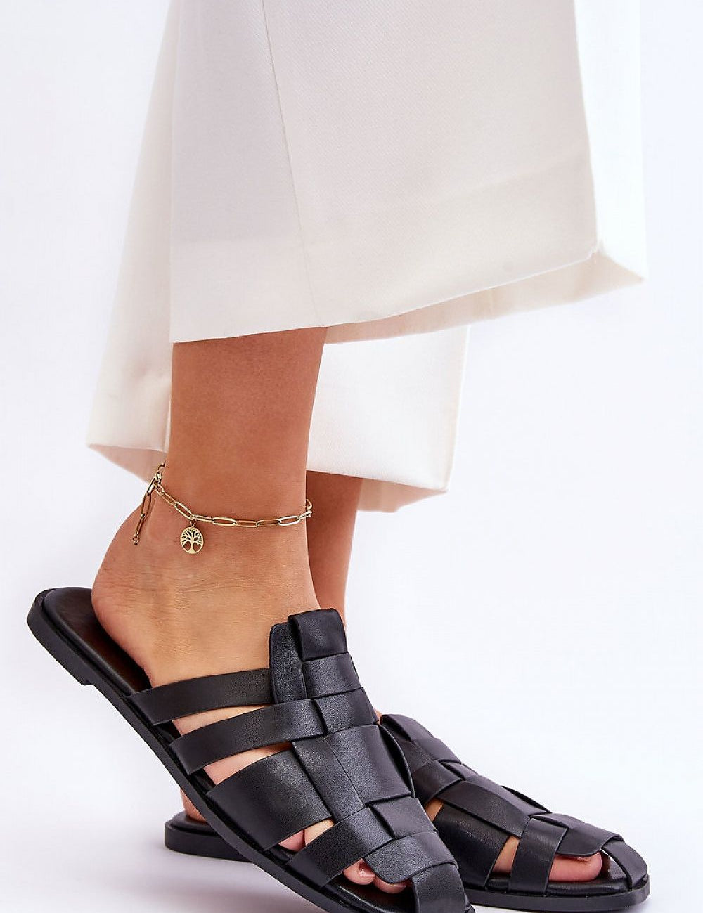 Rovella Slip-On Flat Flip-Flops in black eco leather, featuring a cushioned insole and rubber sole for comfort and slip resistance.