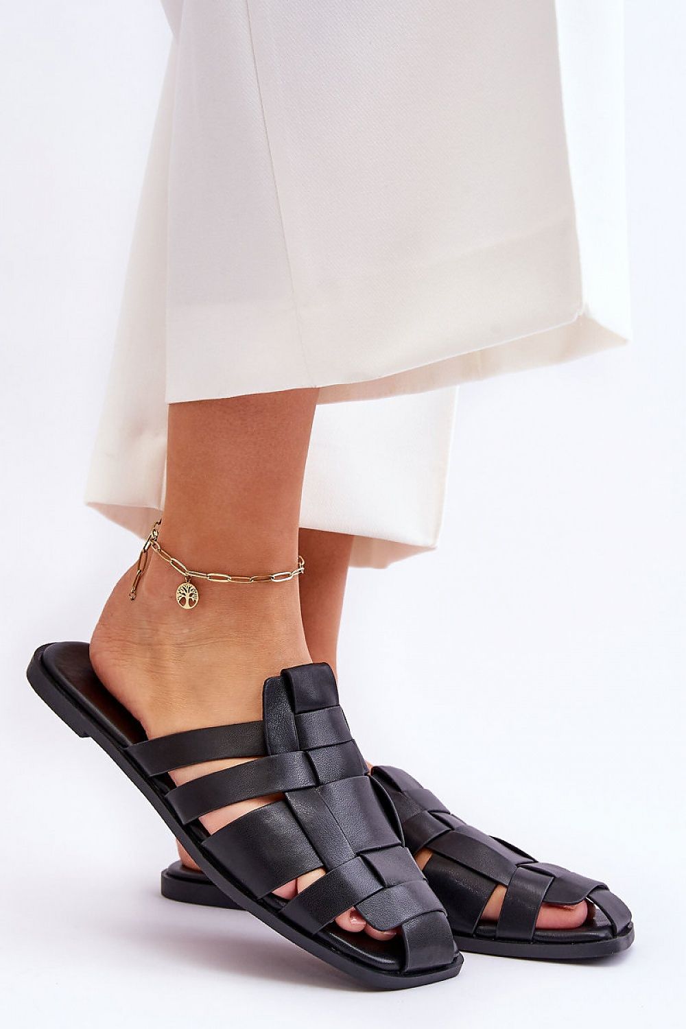 Rovella Slip-On Flat Flip-Flops in black eco leather, featuring a cushioned insole and rubber sole for comfort and slip resistance.