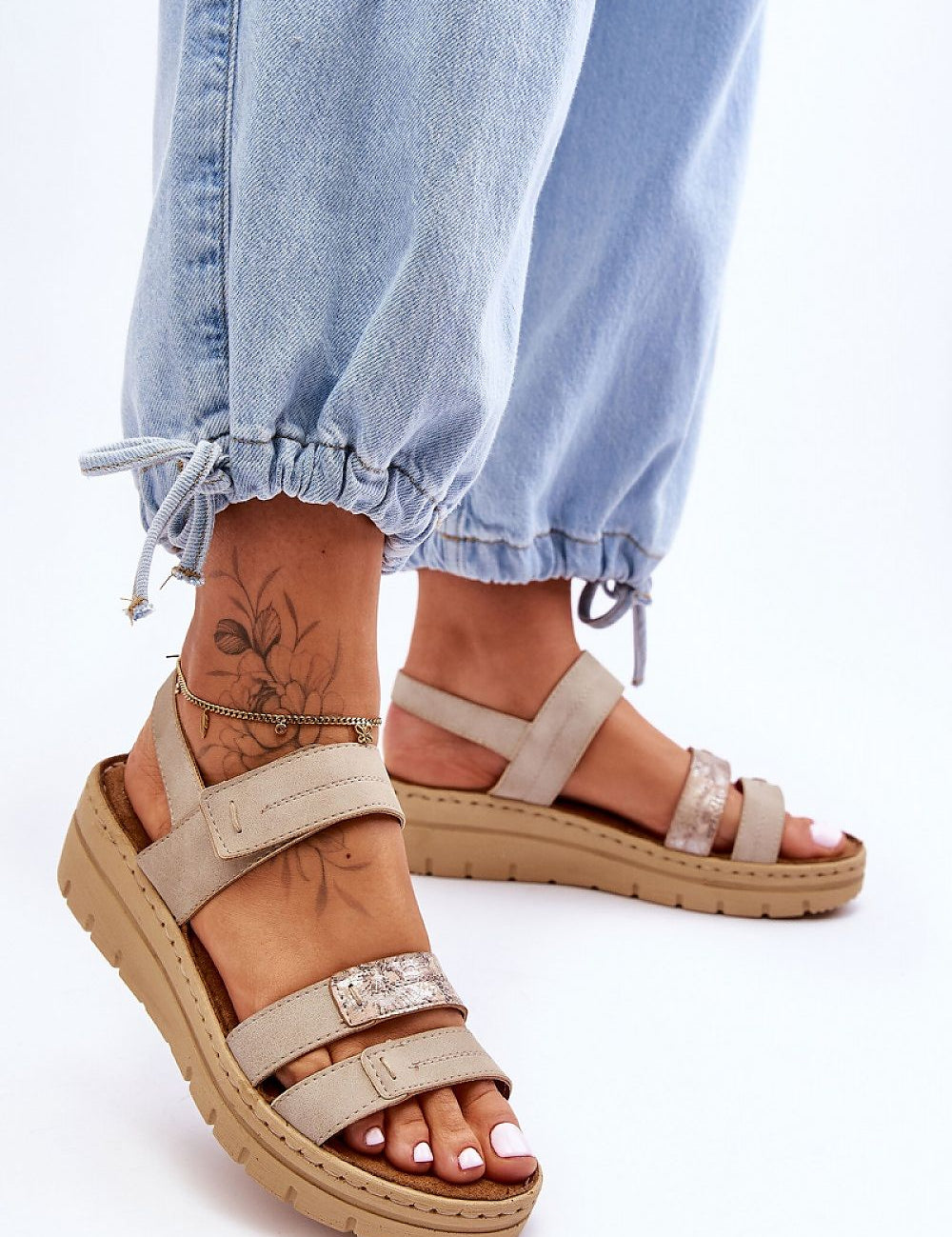 Model wearing Sivetta Cushioned Platform Sandals with eco leather straps and Velcro fastening, paired with light denim pants.