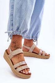 Model wearing Sivetta Cushioned Platform Sandals with eco leather straps and Velcro fastening, paired with light denim pants.