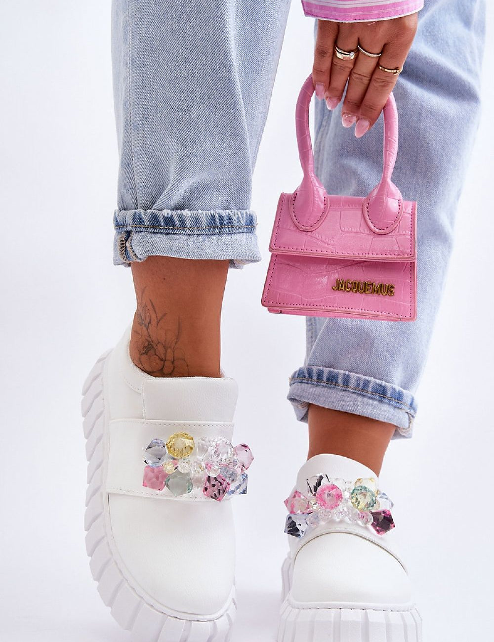 Verelune Crystal Platform Slip-Ons with eco-suede texture and crystal accents, worn with cuffed jeans and a pink handbag.