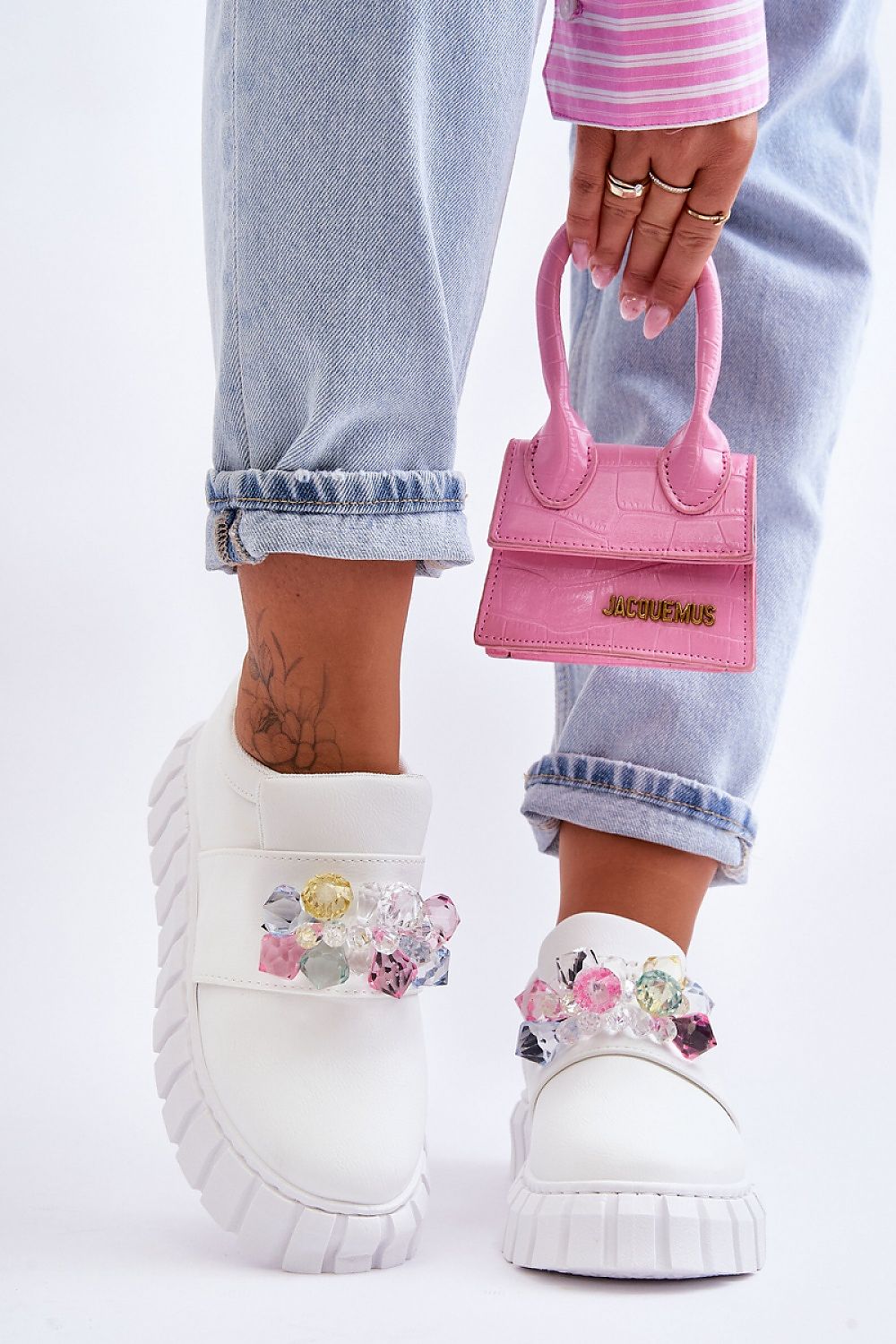 Verelune Crystal Platform Slip-Ons with eco-suede texture and crystal accents, worn with cuffed jeans and a pink handbag.