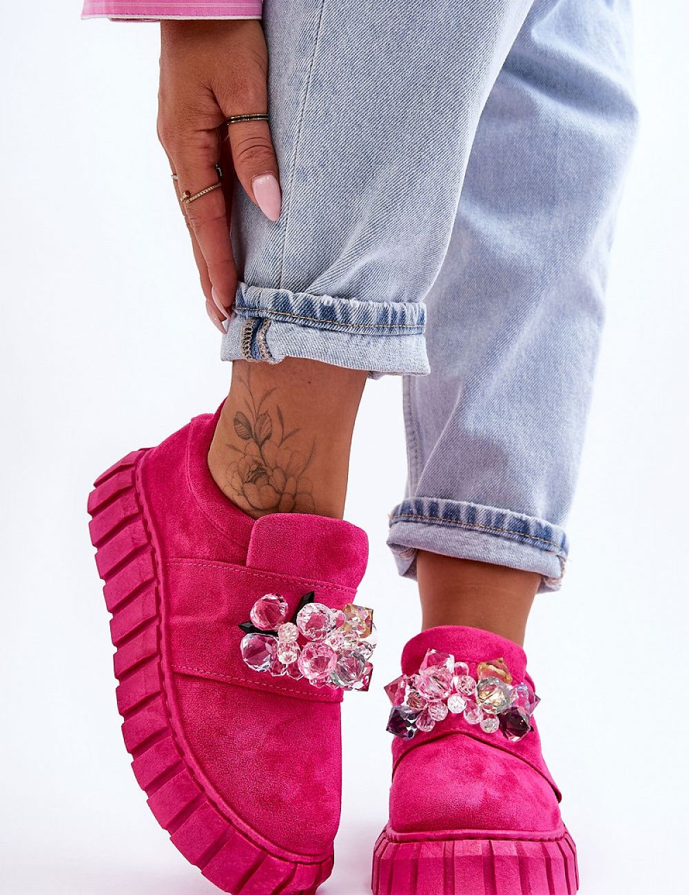 Verelune Crystal Platform Slip-Ons in pink eco-suede with sparkling crystal accents and thick soles, shown worn with light jeans.