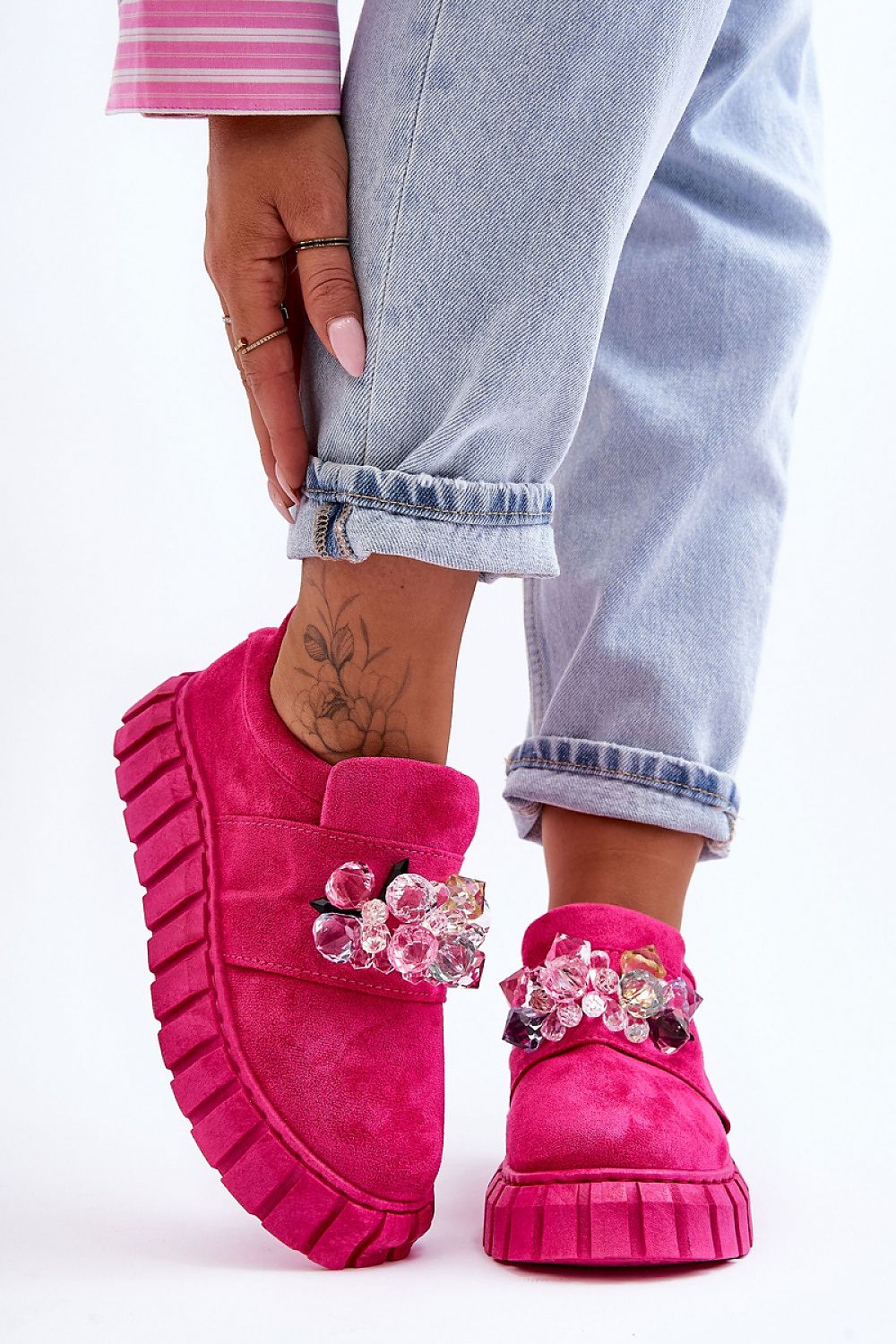 Verelune Crystal Platform Slip-Ons in pink eco-suede with sparkling crystal accents and thick soles, shown worn with light jeans.