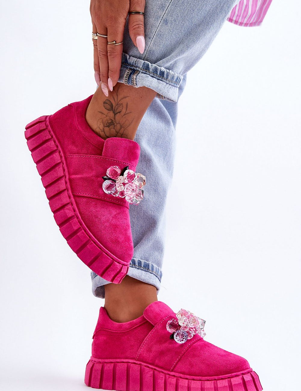 Magenta Verelune Crystal Platform Slip-Ons with eco-suede texture, crystal accents, and thick sole, modeled with cuffed jeans.