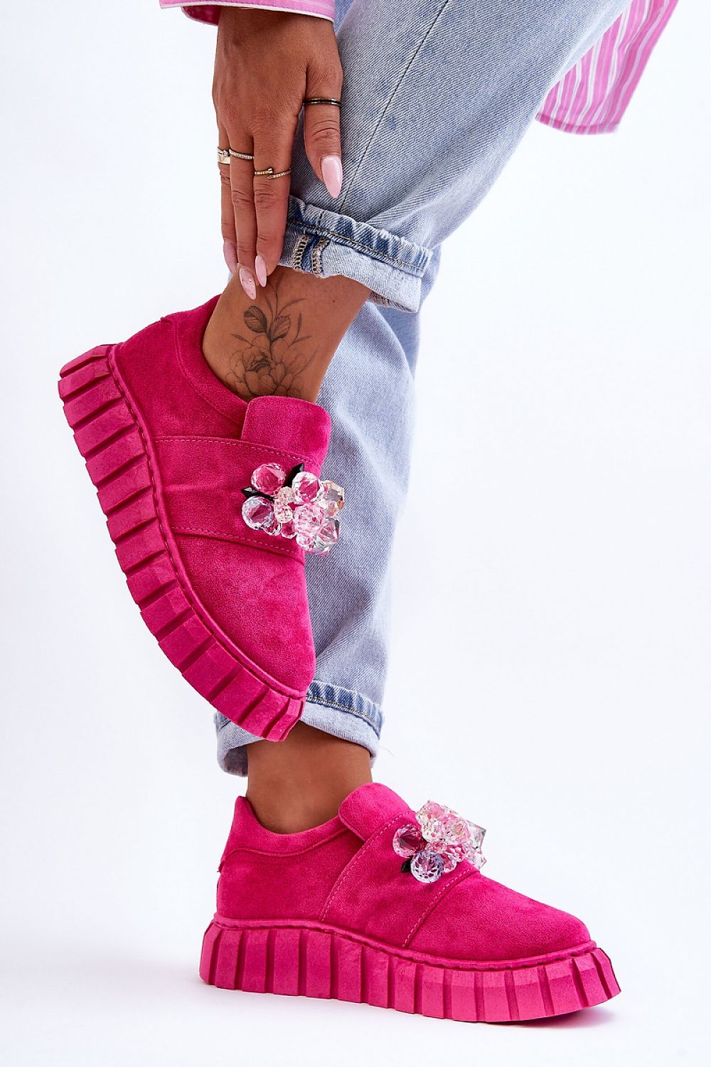 Magenta Verelune Crystal Platform Slip-Ons with eco-suede texture, crystal accents, and thick sole, modeled with cuffed jeans.