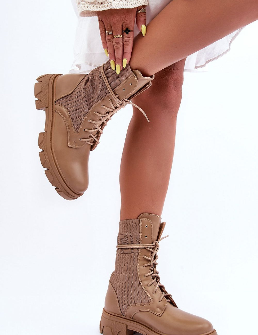 Norvessa Boundlace Sculpted Form eco leather platform boots showcasing bold design with stretch fabric and classic lacing.