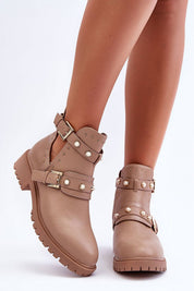 Beige Myrrana Pearlstride slip-on boots with matte eco leather, pearl and stud accents, buckle straps, and treaded platform soles.