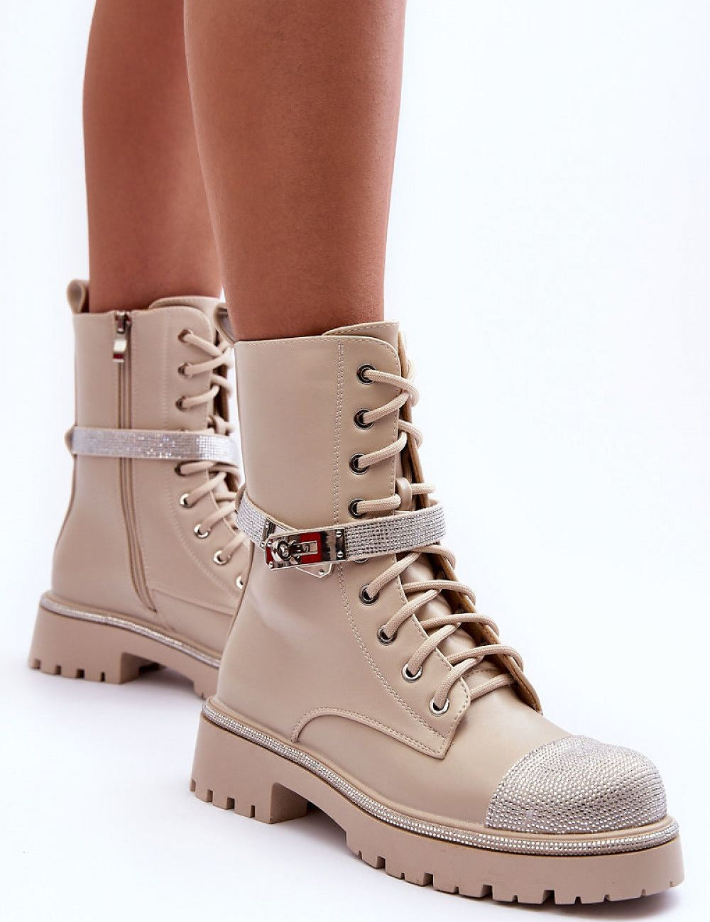 Stylish Lirvanna Ashwalk Ridge Echoes boots with rhinestone strap, grooved sole, and dual zipper-lace closure for comfort and warmth.