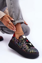 Rinalve Leather Platform Sneakers with colorful design, showcasing comfort and style with a sculpted platform and jewelry charm, worn with light jeans.