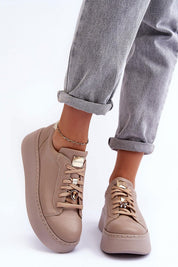Beige Rinalve Leather Platform Sneakers with jewelry charm, worn with rolled-up jeans for stylish comfort.