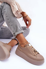 Rinalve Leather Platform Sneakers with jewelry charm, showcasing comfort and style, worn with jeans for a chic look.