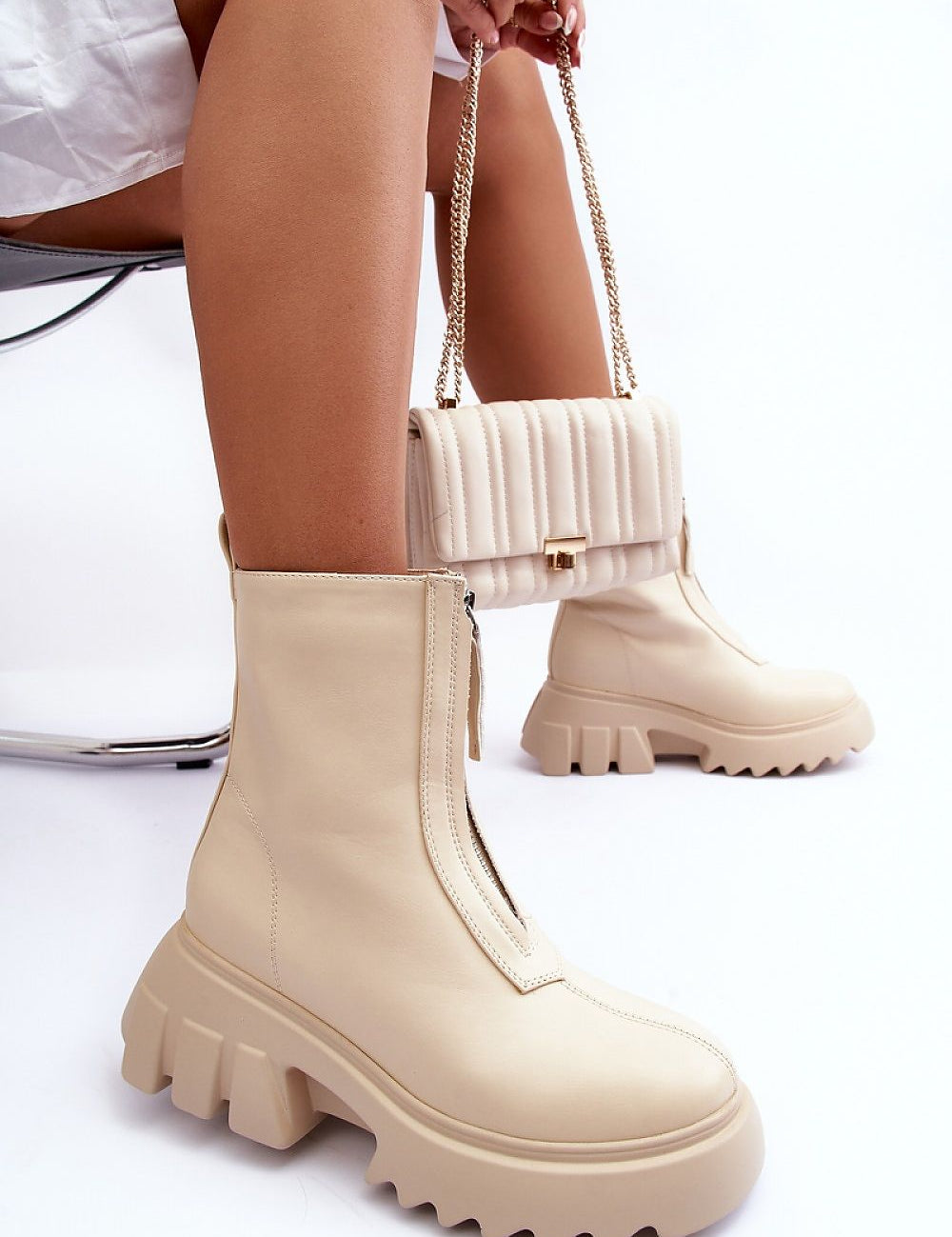 Woman wearing Zarosa Chunky Platform Zip Boots in beige, showcasing smooth eco leather and thick platform design for bold style.