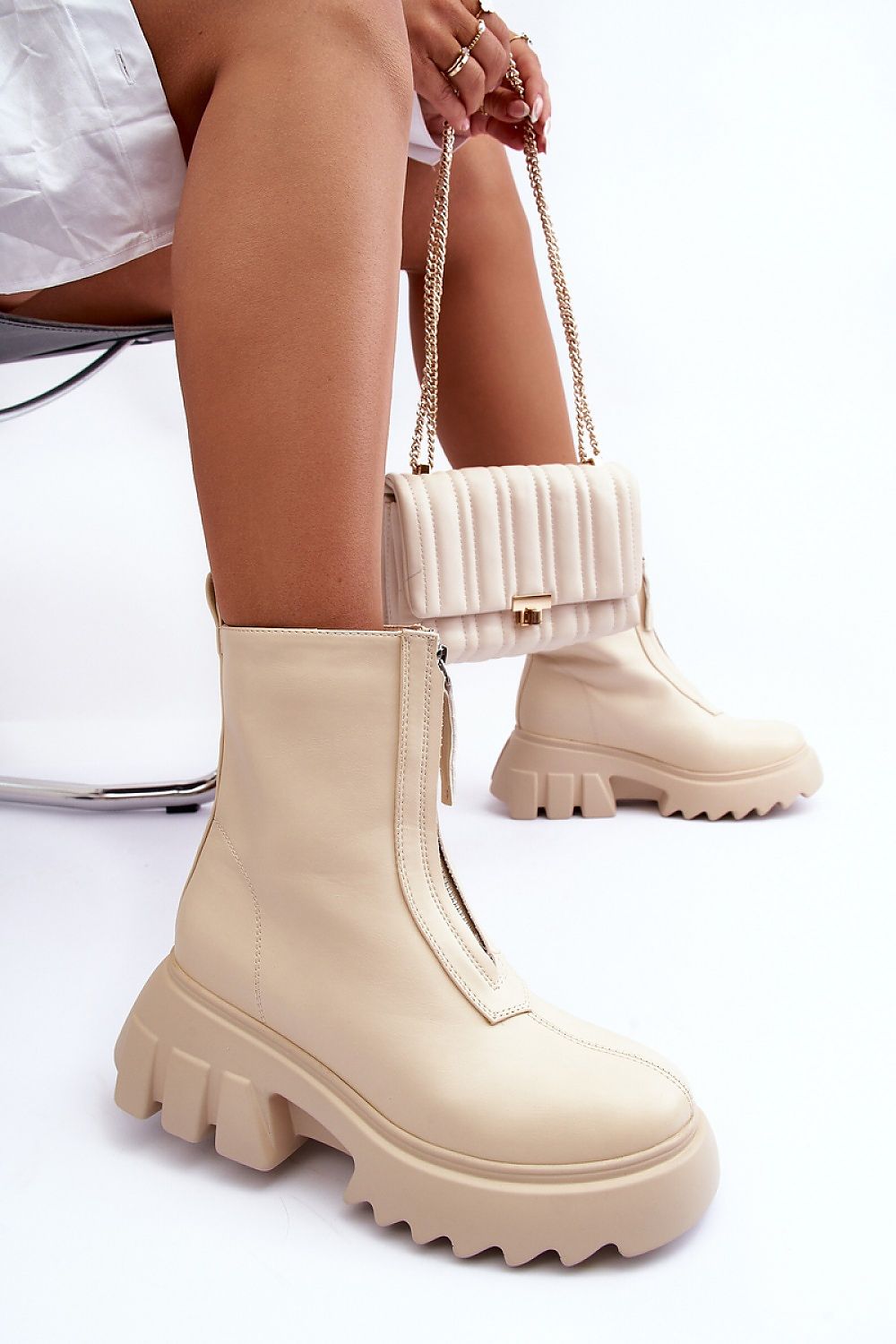 Woman wearing Zarosa Chunky Platform Zip Boots in beige, showcasing smooth eco leather and thick platform design for bold style.